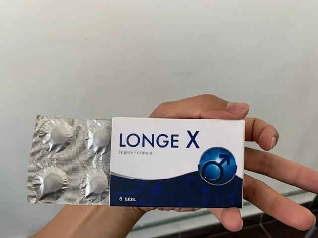 Frente de la caja Longe X Nueva Fórmula 6 tabs. junto a su blíster, en la mano